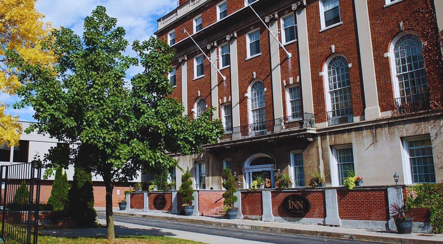 Exterior view of the Inn on Broadway, a historic boutique hotel in Rochester, NY, showcasing its elegant architecture.